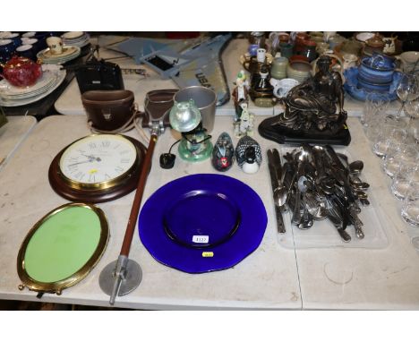 A reproduction classical style figure; a quantity of various cutlery, a blue glass platter, a battery operated wall clock, a 