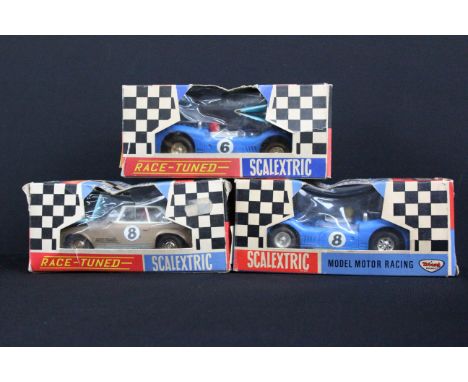 Three boxed Scalextric slot cars to include Race-Tuned C32 Mercedes in brown with blue figure, Race-Tuned C11 Super Electra i