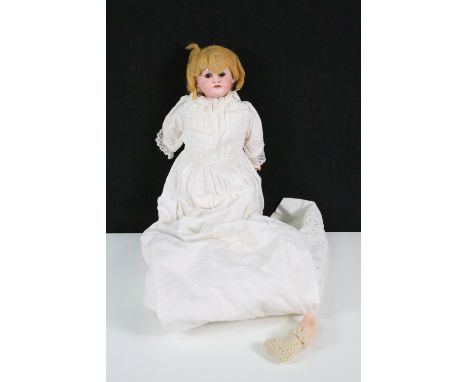 Armand Marseille bisque headed doll with brown sleeping eyes, hand painted facial features and blonde hair in long white fril