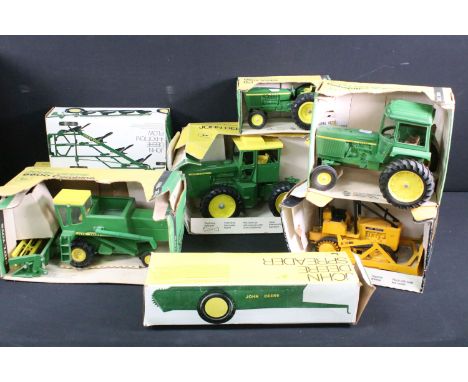 Eight boxed ERTL John Deere related farming and commercial diecast models to include John Deere 4-Bottom Plow, John Deere 660