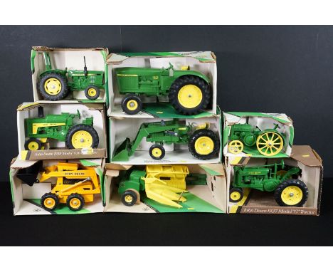 Eight boxed John Deere related diecast model tractors to include ERTL No. 517 Utility Tractor With End Loader, ERTL No. 554 S
