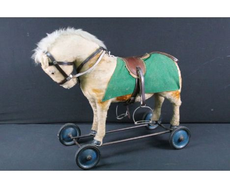 Steiff mohair pony ride along on wheels with pull cord for sound, with short mane and tail, complete with button to ear