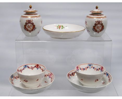 Two 18th century porcelain tea bowls and saucers, probably by New Hall, decorated with hand-painted floral sprays, saucers 13