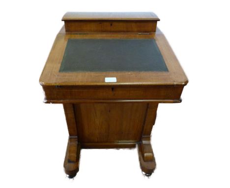Victorian inlaid davenport with stationery compartment above a tooled writing flap enclosing pigeonholes, four drawers with t