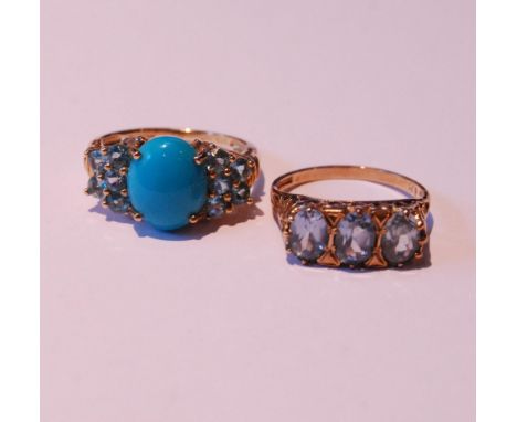 Gold ring with three aquamarines and another, both 9ct gold, sizes R and S/T, 7.7g gross.&nbsp; (2)