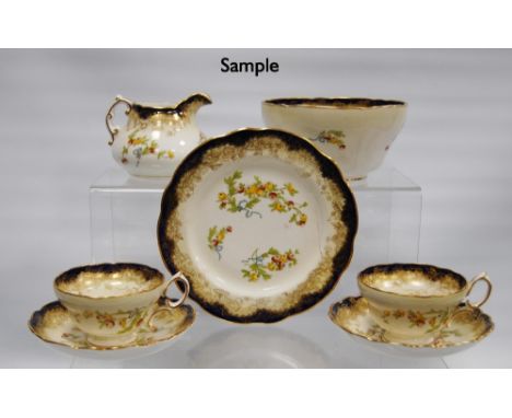Hammersley twelve-setting china tea service, c. early 20th century, decorated with sprays of berries on a cream ground with c