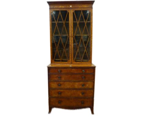 George III satinwood bookcase on secretaire chest in the Sheraton style, with two astragal glazed doors enclosing a shelved i