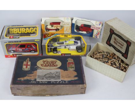 Bburago - Lledo - Jigsaws. An ecclectic selection of boxed diecast models x 4 and vintage jigsaw puzzles x 2 to include: Bbur