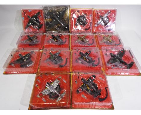 A collection of fourteen various diecast model aircraft with display stands, models appear M and are contained in bubble pack