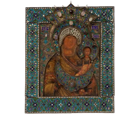 Russian icon from the 18th century, with 19th century cover."Odighitria". Painting on wood, with silver case, enamels, semi-p