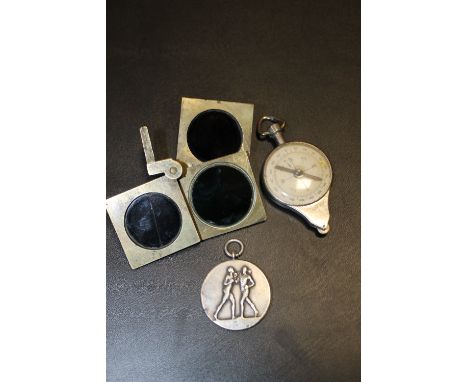 A BOX CONTAINING A BOXING MEDAL, COMPASS ETC (3)