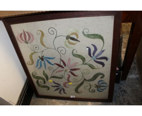 A FRAMED & GLAZED WOOLLEN TAPESTRY PANEL