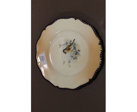 A ROYAL WORCESTER HAND PAINTED CABINET PLATE, central decoration depicting a bird with blossom and foliage, a second bird in 