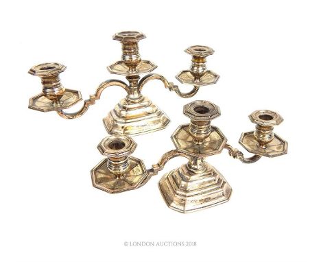 A pair of sterling silver candelabra, Mappin & Webb, Sheffield 1948, each for three candles, having two scrolling branches, w