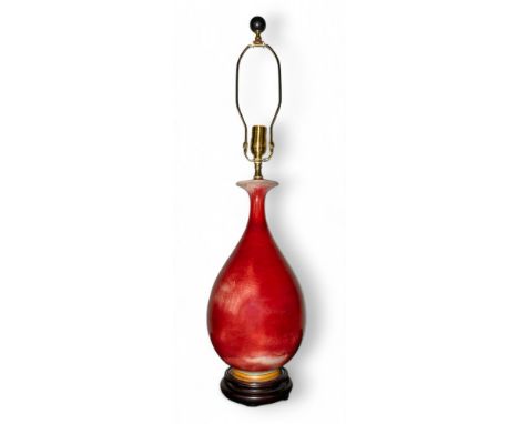 Chinese, 20th century A sang de boeuf lamp  Dimensions: 17 in. (H) x 8 in. (D)