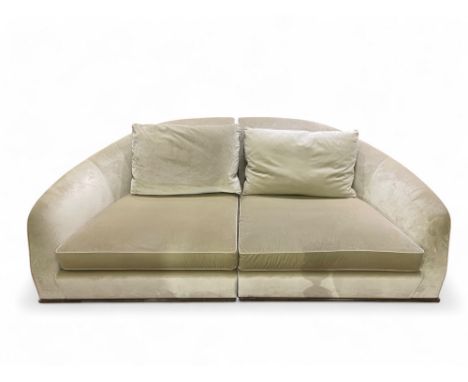 FlexformA large beige sofa, together with a matching velvet footstoolDimensions:(Footstool) 19 in. (H) x 35 in. (W) x 19 in. 