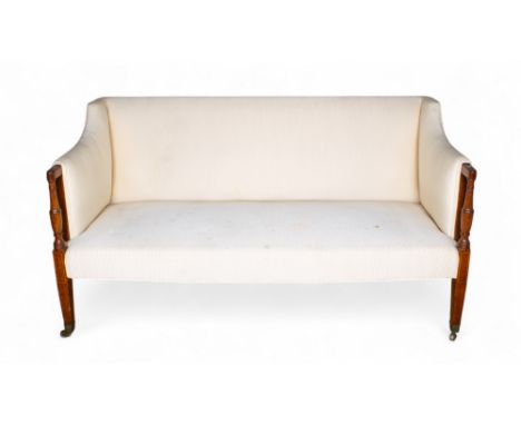 Regency An upholstered straight-back sofa with mahogany arms and brass casters  Property of a lady  Dimensions: 36 in. (H) x 