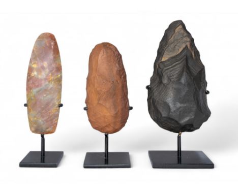 Three flint handaxes Paleolithic-Neolithic period, circa 200,000-6,000 B.C.&nbsp; Including a Saharan black stone handaxe wit