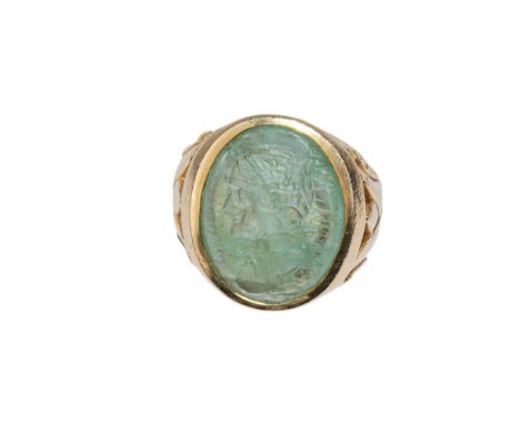 Ancient (?) An emerald intaglio, possibly of the Emperor Vespasian, within a heavy 14 k yellow gold setting.  Weight:  Approx