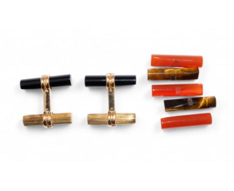 Boucheron Paris A pair of 18 k gold and interchangeable carnelian, black onyx and tiger’s eye cufflinks.