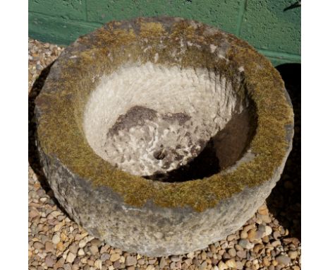 A circular sandstone trough with hewn centre, 59cm diameter
