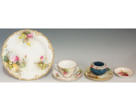 A Royal Worcester shaped circular cabinet plate with shell and leaf moulded rim, the plate painted with yellow and pink roses