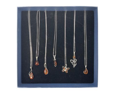 Seven silver Baltic amber pendant necklaces, including octopus and butterfly designs, all stamped 925 