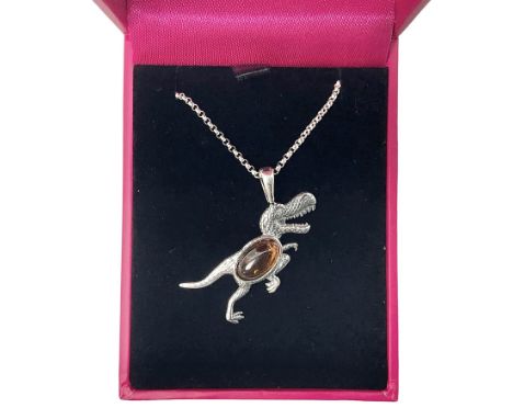 Silver Baltic amber dinosaur pendant necklace, stamped 925 