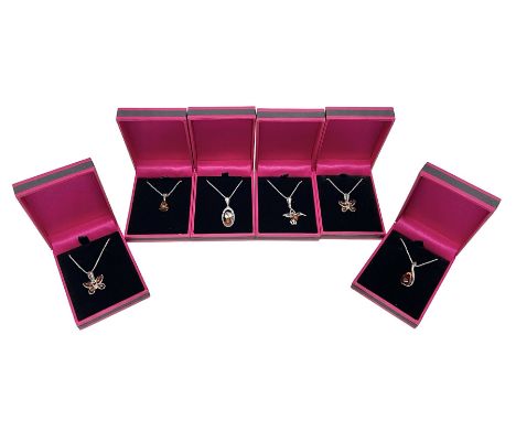 Six silver Baltic amber pendant necklaces, including dinosaur and butterfly designs, all stamped 925 