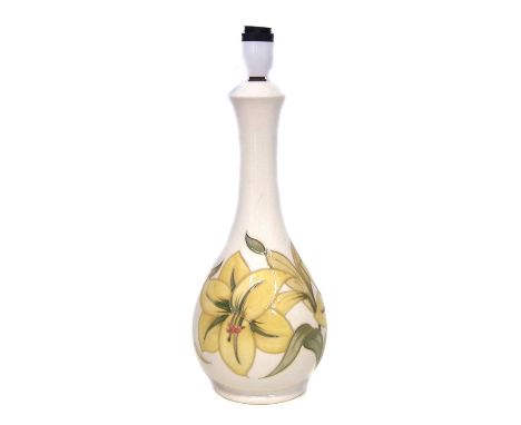 Moorcroft lamp, decorated with yellow hibiscus pattern. 34cm high excluding fittings. Condition report: No damage or restorat