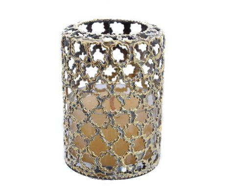 A silver tea candle holder by Stuart Devlin, of bi-colour design, the polished silver base supporting a clear glass candle, w