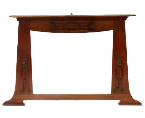 Arts &amp; Crafts design oak framed overmantel mirror, fretwork decoration supporting oval ceramic cameos, bevelled mirror.wi