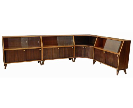 Four walnut finished wall units by Greaves and Thomas "Put-U-Up", three units with glass sliding doors above wooden sliding d