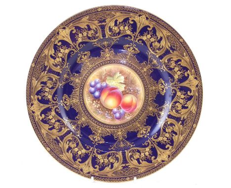 Royal Worcester plate signed Leaman, painted with fruit within an blue and gilt border.27cm diameter Condition report: No dam