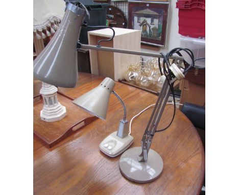 An angle poise desk lamp together with another lamp
