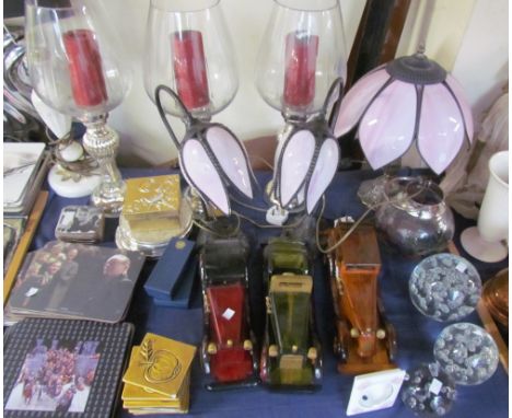 A Tiffany style table lamp with pink glass shade together with a similar pair of table lamps, storm lights, place mats, model