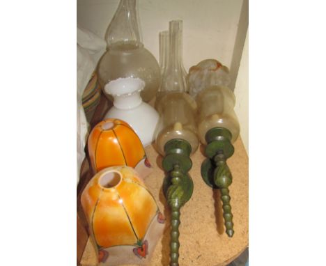 A pair of glass and verdigris metal wall lamps together with glass lamp shades etc