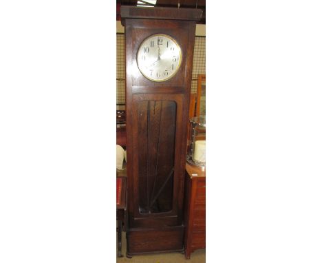 A 20th century oak longcase clock, the silvered dial with Arabic numerals on a plinth base together with a leather topped sof