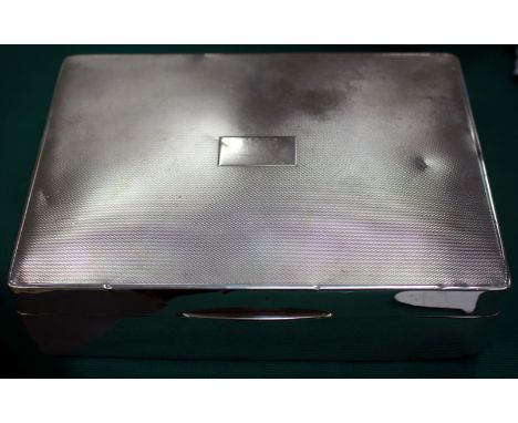AN EARLY 20TH CENTURY SILVER AND CEDAR LINED CIGARETTE BOX with engine turned decoration to the lid