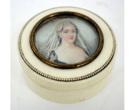 A 19TH CENTURY CYLINDRICAL IVORY BOX AND COVER inset with a miniature portrait of Agnes Sorel, 8cm wide