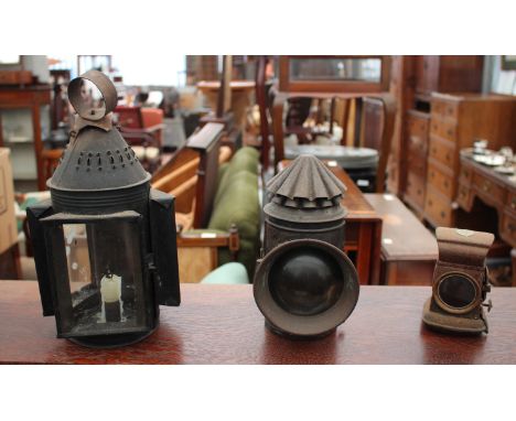 A 19TH CENTURY PRESSED TIN THREE-LIGHT CANDLE LANTERN together with two further lanterns