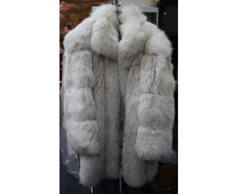 A CHRISTIAN DIOR BOUTIQUE WHITE FUR COAT together with a Christian Dior boutique white fur hat with original box (2)