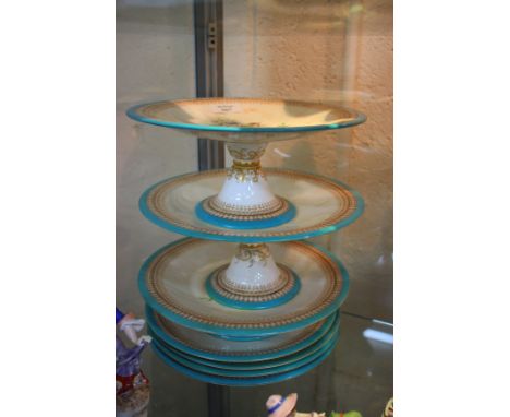 A ROYAL WORCESTER PART DESSERT SERVICE consisting of two high cake stands and a short cake stand and four side plates, each d