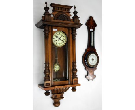 A CONTINENTAL WALNUT VIENNA REGULATOR TYPE WALL CLOCK, the two part dial and decorative turned ornamentation to the case, 92c