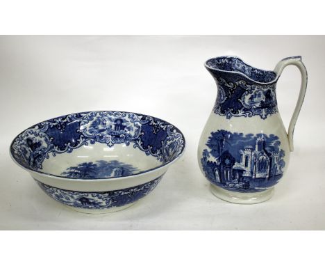 A VICTORIAN ABBEY PATTERN BLUE AND WHITE WASH JUG AND BASIN, the basin 35cm diameter