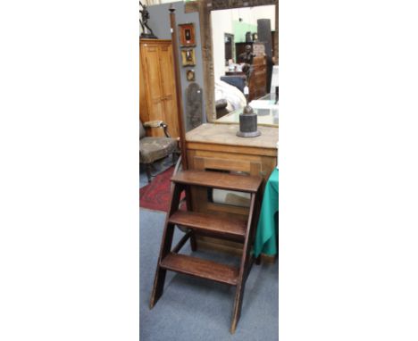 A SET OF MAHOGANY LIBRARY STEPS, the vertical hand post with turned finial, the steps 57cm wide x 171.5cm high