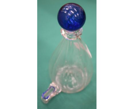 AN OLD GLASS BIRD FEEDER with blue finial, 15cm high