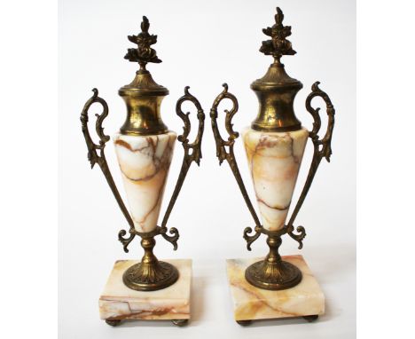 A PAIR OF LATE 19TH/EARLY 20TH CENTURY CONTINENTAL GILT METAL AND MARBLE URNS each mounted by flower finial with scrolling ha