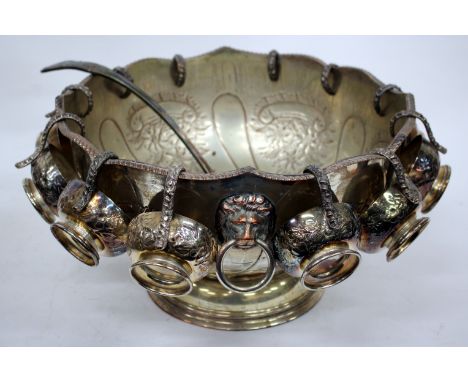 A SILVER PLATED PUNCH BOWL with undulating gadrooned rim, lion mask ring handles and embossed floral decoration on a circular