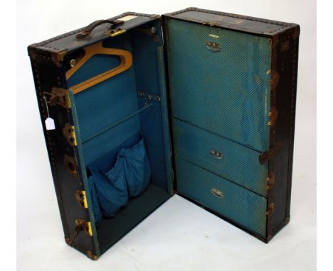AN EARLY 20TH CENTURY' WATAJOY' HARROD'S LTD., SECRETAIRE TRUNK having a chequered interior 94cm in height 